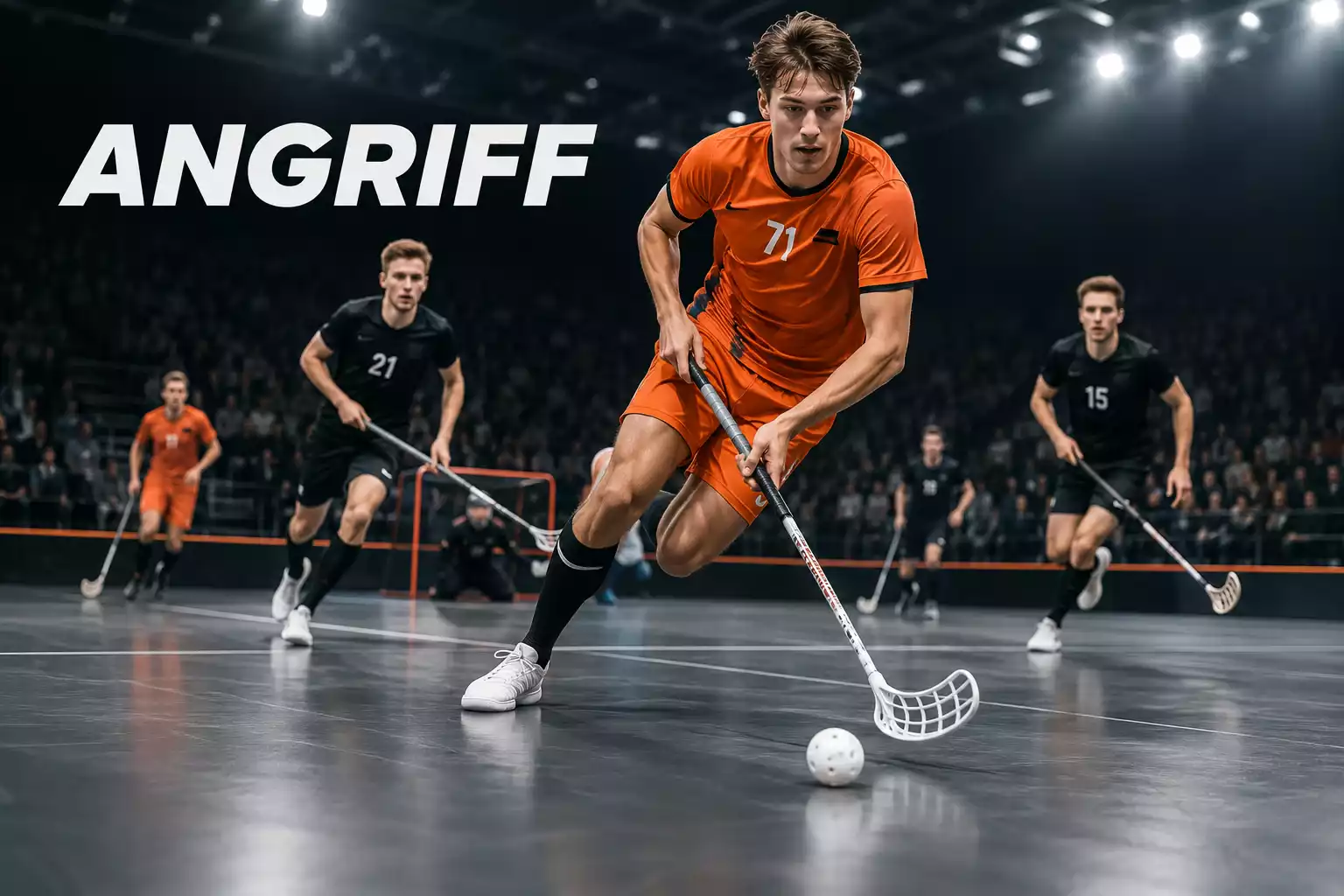 Spieler einer Unihockey-Mannschaft in oranger Ausrüstung beim schnellen Angriff in einer Halle